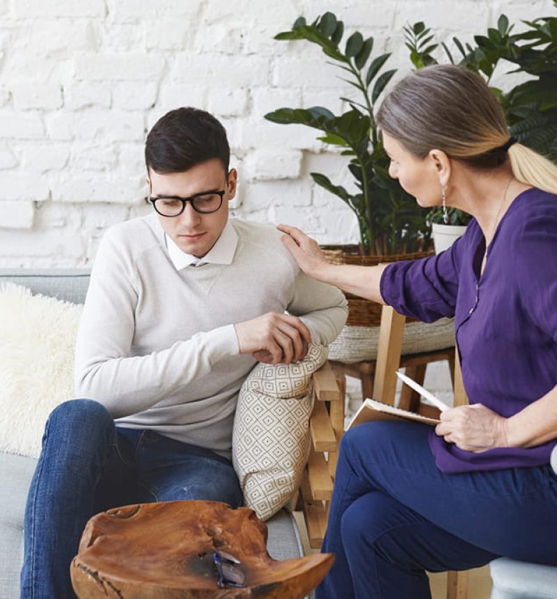 woman-with-hands-together-talking-with-counselor-1536x1025.jpg-1